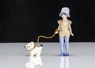 Lot 140 - A rare Hertwig all-bisque dolls’ house long legged girl with puppy