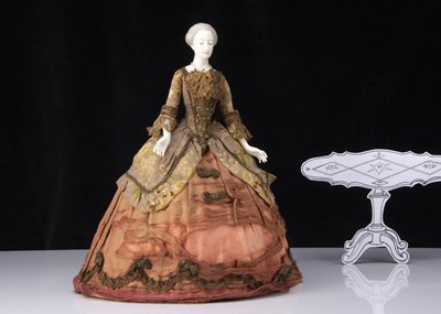 Lot 205 - A rare Nymphenburg china shoulder-head tea/coffee cosy 18th century lady doll circa 1908