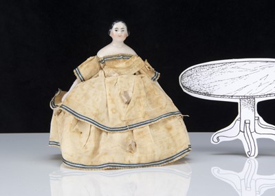 Lot 288 - A mid 19th century German pink tinted dolls’ house shoulder head doll