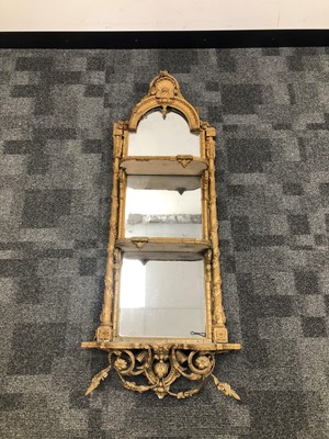 Lot 43 - A gilt gesso wirework mirror backed three tier shelf