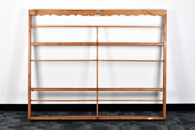 Lot 69 - A 19th century pine wall mounted plate rack