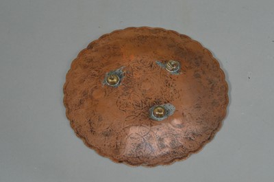Lot 82 - An Indian copper and silver inlaid small dish