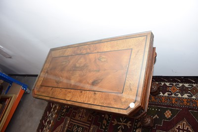 Lot 28 - A Victorian walnut and ebony inlaid card table