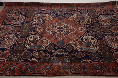 Lot 42 - A vintage Caucasian woollen carpet