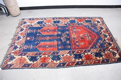 Lot 57 - A vintage Middle Eastern woollen mihrab prayer carpet