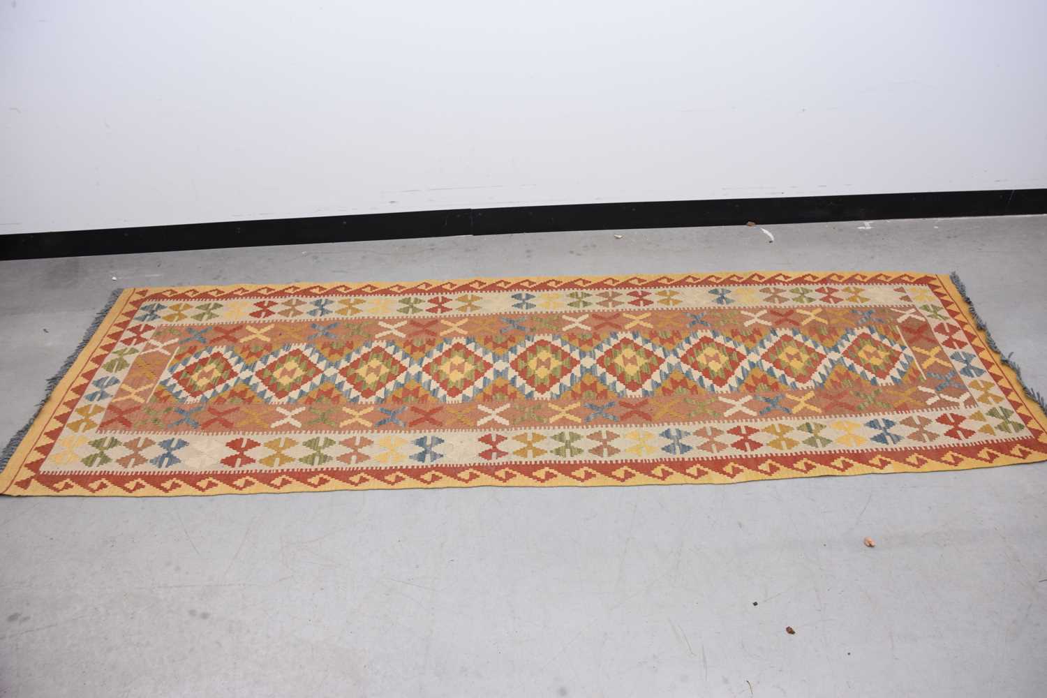 Lot 59 - A mid 20th century Middle Eastern flat weave Kilim runner carpet
