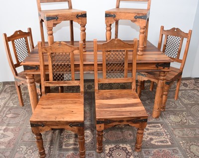 Lot 91 - A modern mango wood and iron dining table and six chairs