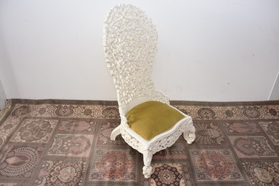 Lot 93 - A later painted Victorian period Anglo-Indian carved hardwood high back chair