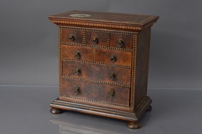 Lot 249 - An antique miniature walnut wood apprentice piece or doll's house chest of drawers