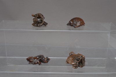 Lot 318 - Four Japanese carved wood netsuke