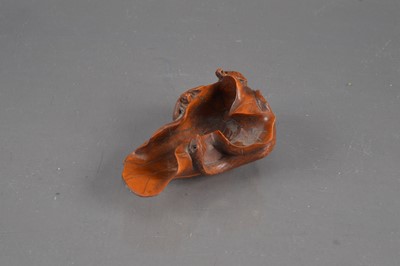 Lot 320 - A Japanese boxwood carving of a lotus leaf