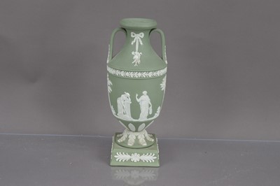 Lot 394 - A Wedgwood green jasperware trophy vase urn