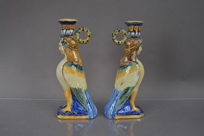 Lot 402 - A pair of faience or majolica neoclassical harpy form candlesticks