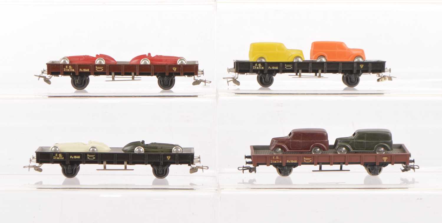 Lot 637 - Rivarossi HO Gauge Flat Trucks with Van/Racing Car Loads (4)