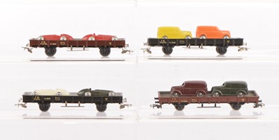 Lot 637 - Rivarossi HO Gauge Flat Trucks with Van/Racing Car Loads (4)