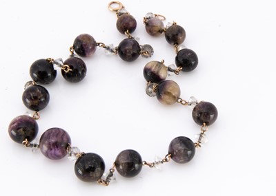Lot 12 - An Edwardian graduated blue john and gold linked necklace