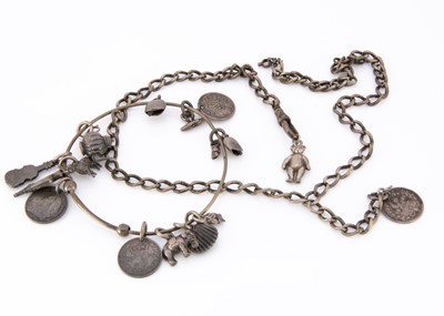 Lot 15 - An Edwardian white metal bangle