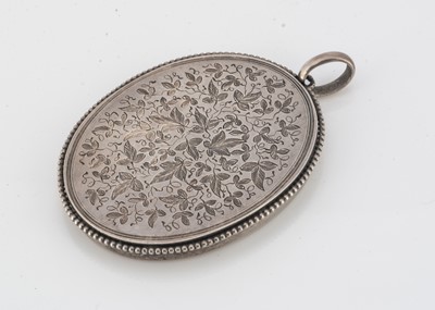 Lot 28 - An Edwardian continental white metal locket