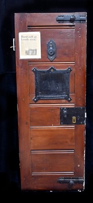 Lot 568 - A pitch pine Cell Door from Louth Police Station