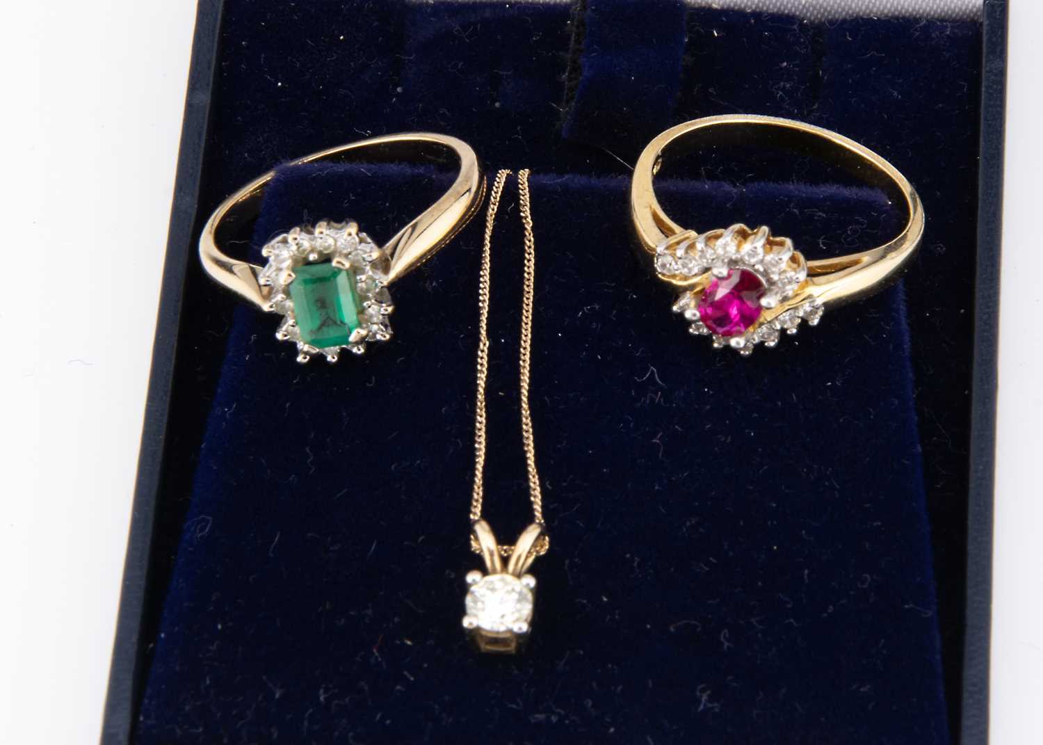 Lot 55 - A 9ct gold emerald and diamond cluster ring