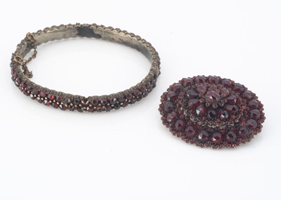 Lot 69 - A Bohemian 19th century oval garnet bangle