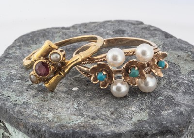 Lot 190 - A continental ruby and pearl crossover dress ring