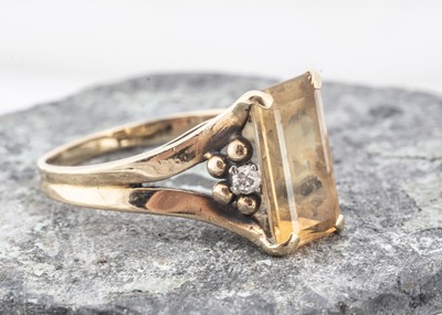 Lot 200 - A topaz and diamond dress ring