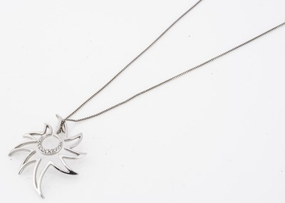 Lot 208 - A contemporary 9ct gold and diamond openwork pendant