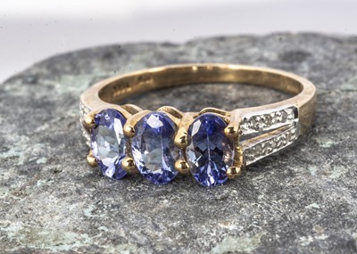 Lot 237 - A 9ct gold tanzanite and white diamond dress ring