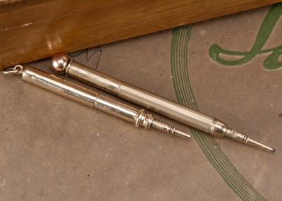 Lot 248 - Two 9ct gold telescopic retractable pencils
