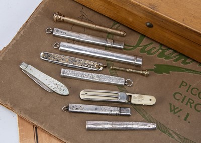 Lot 263 - A small collection of silver and other pencil holders and related items