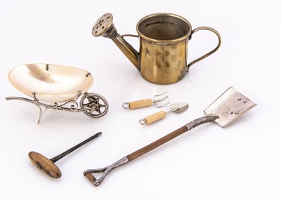 Lot 324 - Two miniature silver mounted dolls' house gardening items