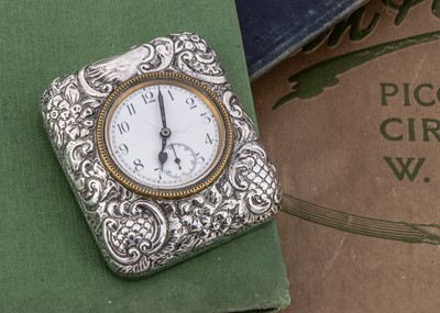 Lot 9 - An Edwardian silver mounted desk clock