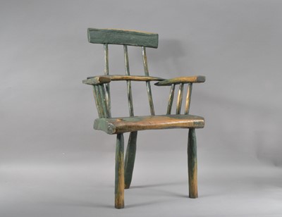 Lot 382 - A 19th century primitive elm stick back child's armchair