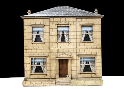 Lot 11 - A mid 19th century English Toyman’s wooden dolls’ house