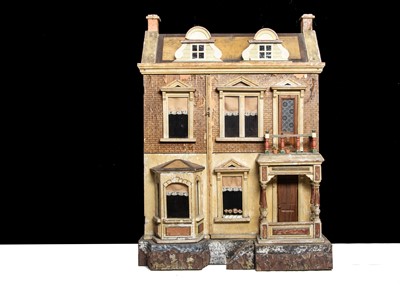 Lot 26 - A Gottschalk wooden dolls’ house raised on a bark base