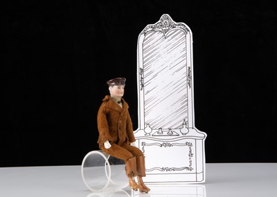 Lot 36 - A rare German bisque shoulder head dolls’ house chauffeur doll