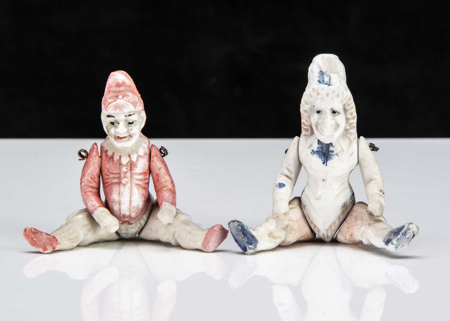 Lot 77 - An all-bisque dolls’ house Punch and Judy dolls
