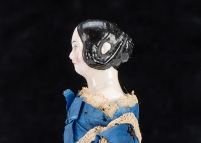 Lot 87 - A rare 19th century Kister pink tinted china shoulder-head dolls’ house doll with jointed wooden body