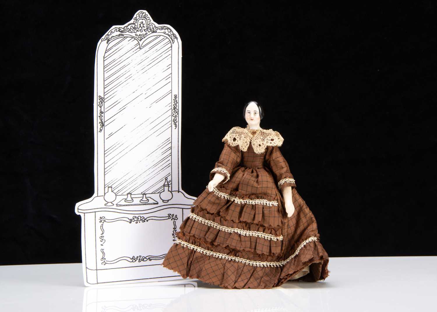 Lot 91 - A rare 19th century Kister pink tinted china shoulder-head dolls’ house doll with jointed wooden body