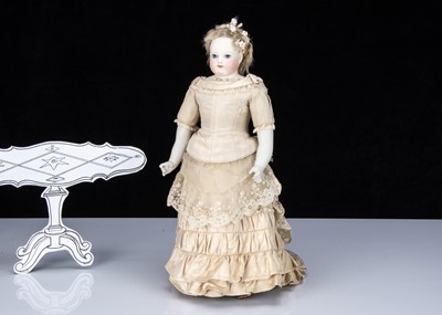 Lot 120 - A French fixed shoulder-head fashionable doll with painted eyes