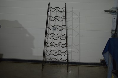 Lot 240 - A useful and neat wrought iron bottle rack
