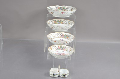 Lot 461 - A graduated set of four 20th Century Dresden porcelain reticulated fruits dishes decorated with roses