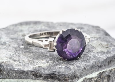 Lot 147 - A platinum and 18ct gold amethyst and diamond dress ring