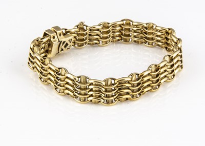 Lot 188 - An 18ct gold wave and baton textured bracelet