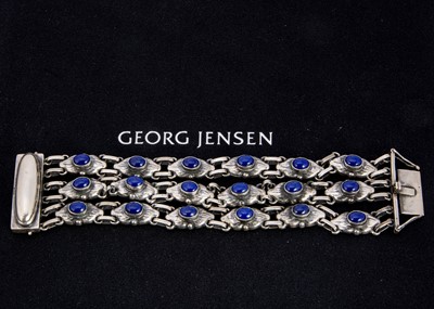 Lot 282 - An early 20th century George Jensen silver and Lapis lazuli three strand no.15