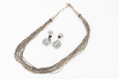 Lot 206 - A multi strand silver and gilt metal bead liquid style necklace