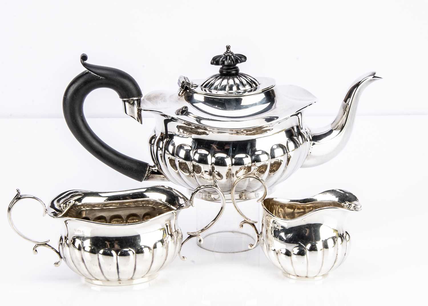 Lot 458 - A George V silver three piece tea set R.O