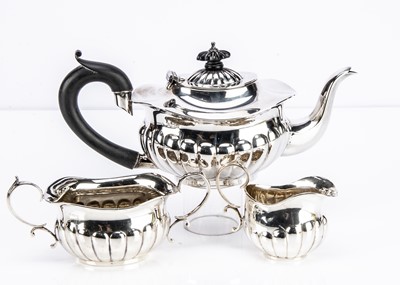 Lot 458 - A George V silver three piece tea set R.O