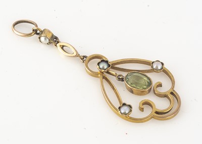 Lot 235 - An Edwardian gold, peridot and seed pearl openwork drop pendant